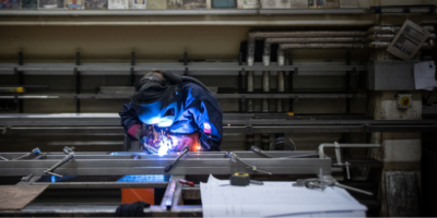 Maria Hucker Scenic Metal Fabricator Apprentice at the National Theatre working on a piece of metal © CameronSlaterPhotography